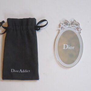 Dior Addict pocket mirror with black carrying pouch.
